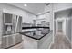 Modern kitchen with stainless steel appliances and a breakfast bar at 1318 Terre Cia Ave, Orlando, FL 32807