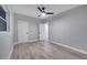 Charming bedroom with double doors and a ceiling fan at 1318 Terre Cia Ave, Orlando, FL 32807