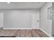 Spacious living area with wood-look flooring and access to backyard at 1318 Terre Cia Ave, Orlando, FL 32807