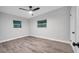 Light and airy bedroom with two windows and ceiling fan at 1318 Terre Cia Ave, Orlando, FL 32807