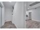 Hallway with view into living area and laundry room at 1318 Terre Cia Ave, Orlando, FL 32807