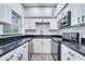 Modern kitchen with white cabinets and granite countertops at 1318 Terre Cia Ave, Orlando, FL 32807