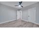 Bright bedroom with ceiling fan and double doors at 1318 Terre Cia Ave, Orlando, FL 32807