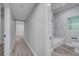 Bathroom with marble tile, a bathtub, and a toilet at 1318 Terre Cia Ave, Orlando, FL 32807