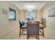 Spacious dining room with wooden table and six chairs at 4721 Clock Tower Dr # 302, Kissimmee, FL 34746