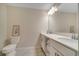 Bright bathroom with double vanity and updated fixtures at 4721 Clock Tower Dr # 302, Kissimmee, FL 34746