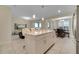 Open concept kitchen with island and breakfast bar seating at 4721 Clock Tower Dr # 302, Kissimmee, FL 34746