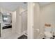 Bathroom with shower, toilet and view of bedroom at 4721 Clock Tower Dr # 302, Kissimmee, FL 34746