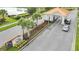 Gated entrance to the community with beautiful landscaping at 4721 Clock Tower Dr # 302, Kissimmee, FL 34746