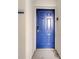 Private entrance with keyless entry and modern blue door at 4721 Clock Tower Dr # 302, Kissimmee, FL 34746