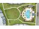 Bird's-eye view of community pool and surrounding green space at 4721 Clock Tower Dr # 302, Kissimmee, FL 34746