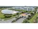 Community entrance with guardhouse and tranquil water views at 4721 Clock Tower Dr # 302, Kissimmee, FL 34746