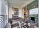 Relaxing balcony with seating and access to the interior at 4721 Clock Tower Dr # 302, Kissimmee, FL 34746