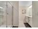 Clean bathroom with a walk-in shower, tiled walls, and modern vanity at 4721 Clock Tower Dr # 302, Kissimmee, FL 34746