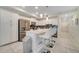 Modern kitchen with white cabinets, stainless steel appliances, and island at 4721 Clock Tower Dr # 302, Kissimmee, FL 34746