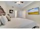 Spacious bedroom with king bed, large TV, and access to bathroom at 4721 Clock Tower Dr # 302, Kissimmee, FL 34746