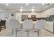 Kitchen island with seating for three at 4721 Clock Tower Dr # 302, Kissimmee, FL 34746
