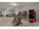 Game room with foosball table, arcade games, and seating area at 3209 Lilac Way, Davenport, FL 33897