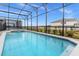 Inviting screened pool with a spacious deck at 3209 Lilac Way, Davenport, FL 33897
