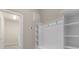 Bright laundry room with washer, dryer, and ample storage at 3209 Lilac Way, Davenport, FL 33897