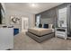 Spacious main bedroom with a king-size bed and en-suite bathroom at 3209 Lilac Way, Davenport, FL 33897