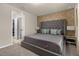 King-size bed and ensuite bathroom at 3209 Lilac Way, Davenport, FL 33897