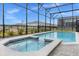 Enclosed pool and spa with a view of the surrounding area at 3209 Lilac Way, Davenport, FL 33897