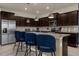 Kitchen island with seating and granite countertops at 3209 Lilac Way, Davenport, FL 33897