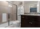 Bathroom with granite countertop and shower at 3209 Lilac Way, Davenport, FL 33897