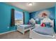 Bedroom with twin beds and Little Mermaid theme at 3209 Lilac Way, Davenport, FL 33897