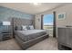 Bedroom with ensuite bathroom and large window at 3209 Lilac Way, Davenport, FL 33897