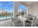 Outdoor patio with table and chairs overlooking the pool at 3209 Lilac Way, Davenport, FL 33897
