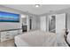 Bright bedroom with a king-size bed and ensuite bathroom access at 4716 Terra Esmeralda Dr, Kissimmee, FL 34746
