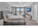 Spacious bedroom with large windows and a king-size bed at 4716 Terra Esmeralda Dr, Kissimmee, FL 34746