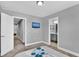 Well-lit bedroom with ensuite bathroom access and a queen-size bed at 4716 Terra Esmeralda Dr, Kissimmee, FL 34746