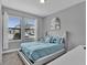 Spacious bedroom with large windows and plush bedding at 4716 Terra Esmeralda Dr, Kissimmee, FL 34746