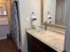 Bathroom with a glass sink and granite vanity at 3100 Parkway Blvd # 611, Kissimmee, FL 34747