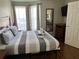 King-size bed, wood floors, and a view at 3100 Parkway Blvd # 611, Kissimmee, FL 34747