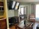 Open living space with a view into the bedroom at 3100 Parkway Blvd # 611, Kissimmee, FL 34747