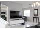 Bright living room with open concept to kitchen and dining area at 338 Earlmont Pl, Davenport, FL 33896