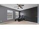 Spacious bedroom with home gym setup and lots of natural light at 338 Earlmont Pl, Davenport, FL 33896