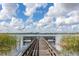 Wooden dock extending over calm lake water at 3663 Julius Estates Blvd, Winter Haven, FL 33881