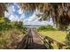 Wooden dock extending over calm lake water at 3663 Julius Estates Blvd, Winter Haven, FL 33881