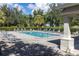 Community pool with lounge chairs and a covered area at 3663 Julius Estates Blvd, Winter Haven, FL 33881
