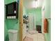 Clean bathroom with a shower, toilet, and vanity at 50 2Nd St, Saint Cloud, FL 34769