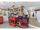 Well-organized garage with workbench and storage shelving at 50 2Nd St, Saint Cloud, FL 34769