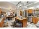 Open kitchen with an island, stainless steel appliances, and a dining area at 50 2Nd St, Saint Cloud, FL 34769