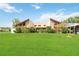 Mid-century modern home with a large lawn at 50 2Nd St, Saint Cloud, FL 34769