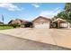 Brick home with a large driveway, carport, and detached garage at 50 2Nd St, Saint Cloud, FL 34769