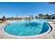 Large freeform pool with plenty of lounge chairs and shade structures at 9047 Rhodes St, Kissimmee, FL 34747
